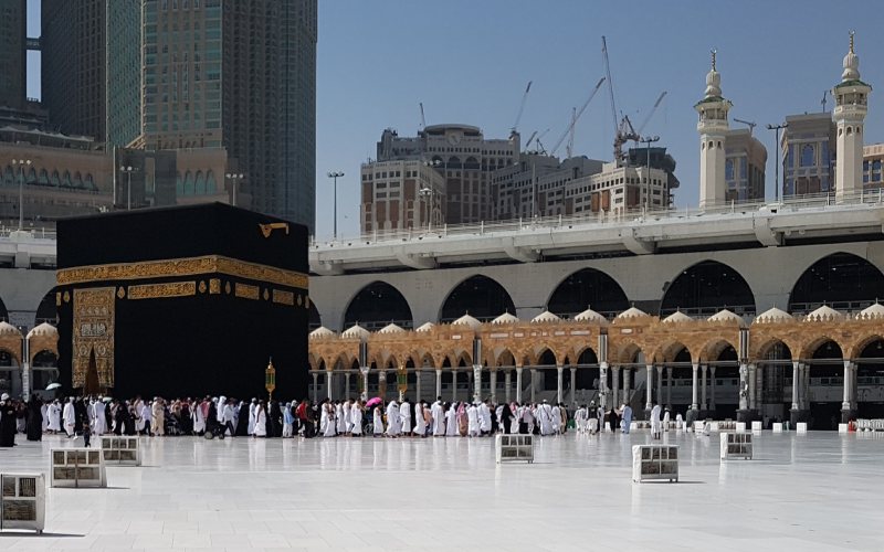 a group of people in mecca in Saudi Arabia