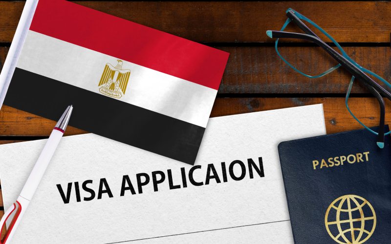 Egypt visa application form with passport and flag image.